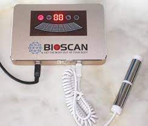 Bioscan device with digital display and attached handheld probe on a white surface.